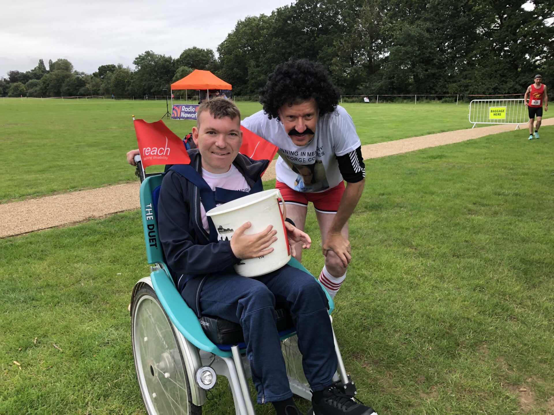 Man in wheelchair with man in fancy dress