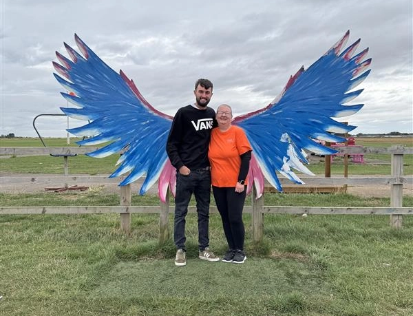 2 people with wings behind them